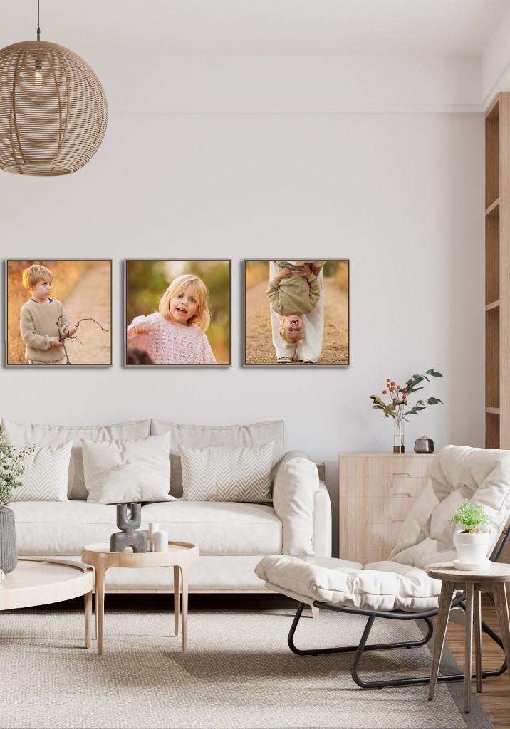 Three framed canvas portraits displayed above a sofa in a living room