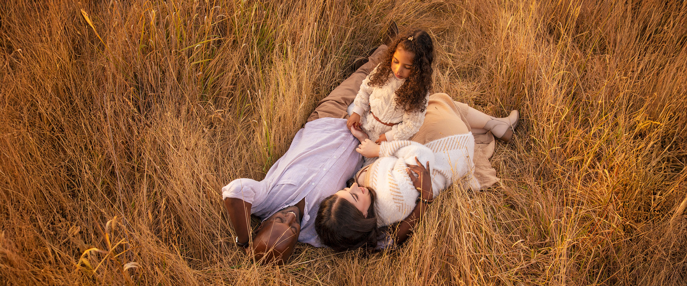 Family portrait at golden hour with warm natural light