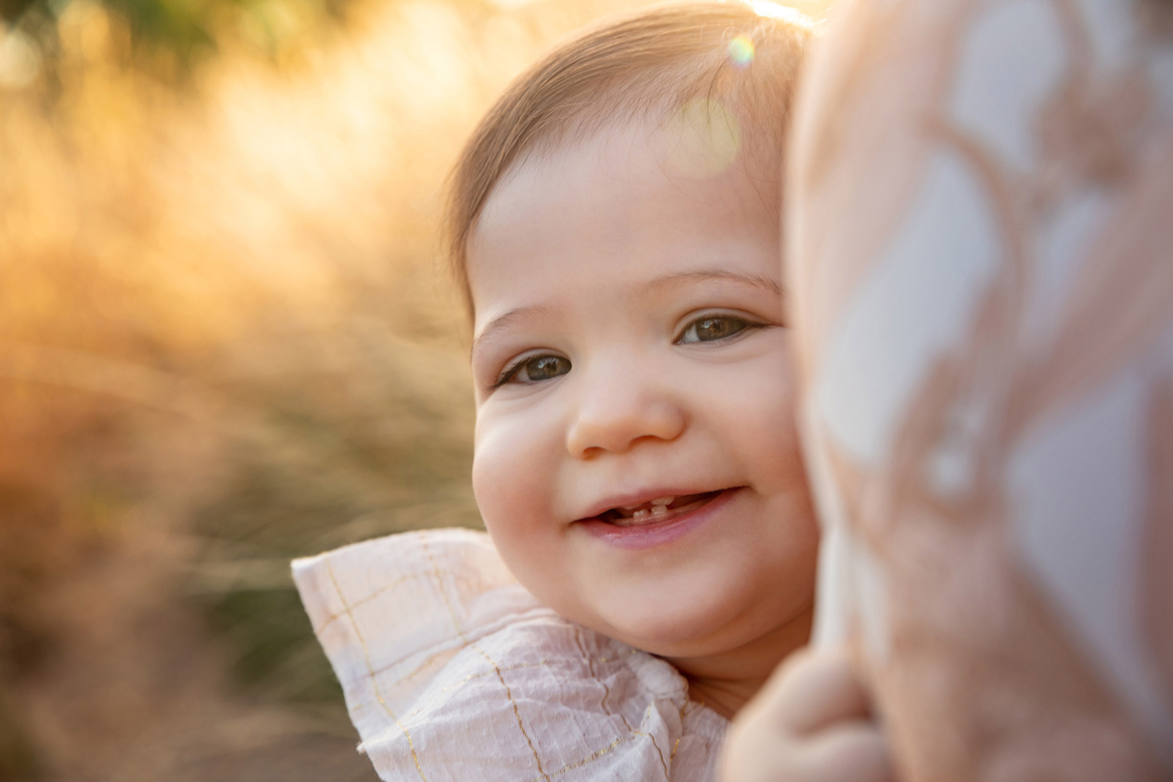 Toddler portrait at sunrise in golden light